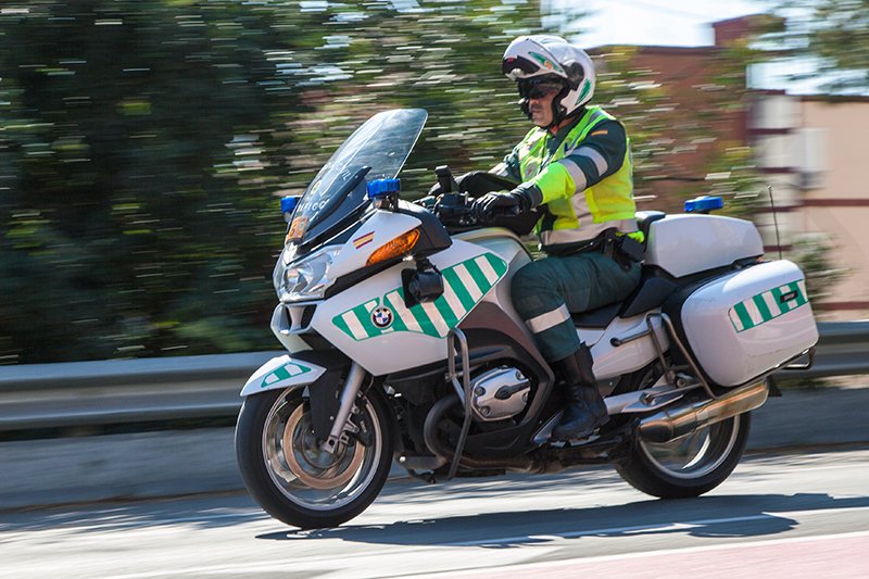 Police officer wearing Schuberth C3 Pro helmet on motorcycle